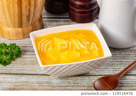 Golden Ghee melted homemade butter Golden Ghee melted homemade butter 129516476