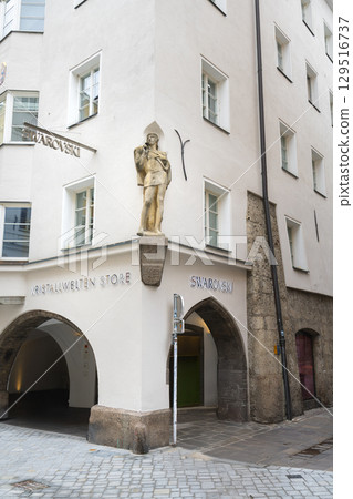 A statue on the corner of an ancient building in Innsbruck, Austria A statue on the corner of an ancient building in Innsbruck, Austria 129516737