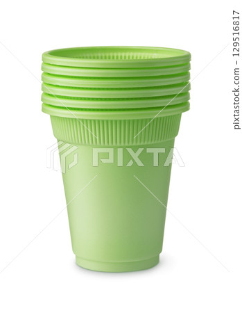Stack of green disposable biodegradable plastic cups 129516817