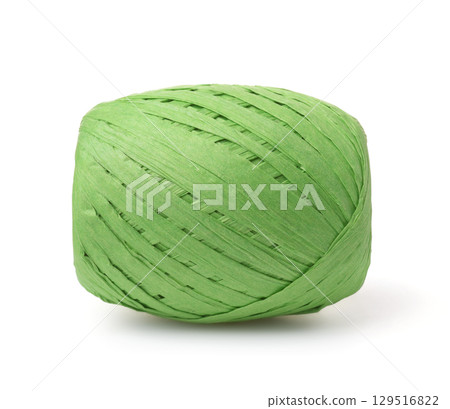 Side view of green raffia paper ribbon skein Side view of green raffia paper ribbon skein 129516822