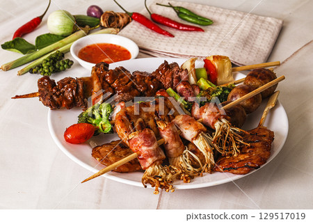 Asian grilled skewer assortment satay 129517019