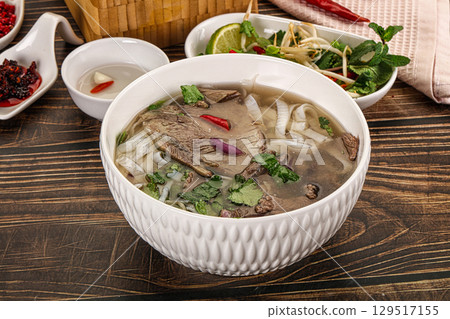 Vietnamese Pho Bo soup with beef and noodles 129517155