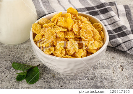Corn flakes with milk for breakfast Corn flakes with milk for breakfast 129517165