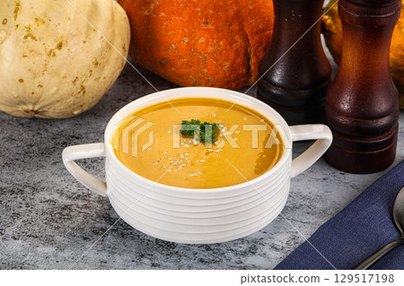 Vegan pumpkin cream soup served sesam 129517198