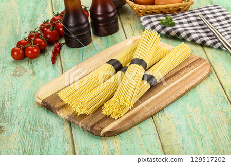 Raw dry uncooked egg noodles 129517202