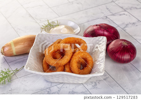 Golden fried onion rings snack 129517283