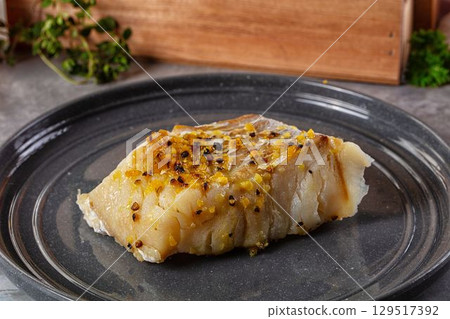 Steamed cod fish fillet with spices 129517392