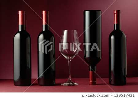 Red wine on a dark red background. 129517421