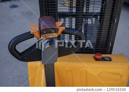 close up of forklift hand stacker hydraulic electric crane close up of forklift hand stacker hydraulic electric crane 129518100