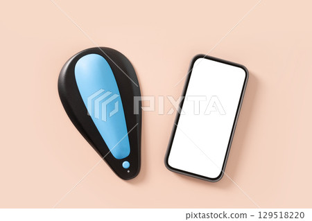 Mens kegel smart trainer and smartphone with empty white blank screen for own apps on beige background. Smart trainer for squeeze pelvic floor muscles with biofeedback and vibration. Modern technology Mens kegel smart trainer and smartphone with empty white blank screen for own apps on beige background. Smart trainer for squeeze pelvic floor muscles with biofeedback and vibration. Modern technology 129518220