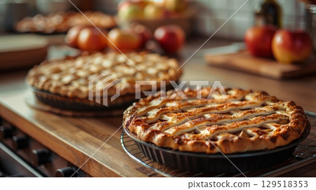 Indulge in Delicious Homemade Apple Pies, Freshly Baked and Ready to Serve at Your Next Gathering or Celebration 129518353