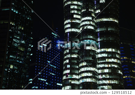 Night illuminated buildings in financial centre in Doha, Qatar Night illuminated buildings in financial centre in Doha, Qatar 129518512