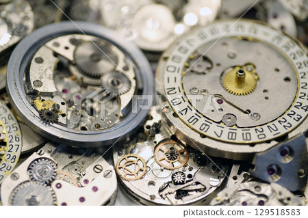 Old mechanical watches with gears and cogs. Watch or clock mechanisms 129518583