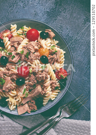 fusilli pasta salad with canned tuna, cherry tomatoes and olives, parmesan, microgreens, homemade, no people, 129518702
