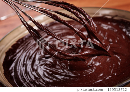 a bowl of chocolate dough, a whisk for whipping, baking, structure and consistency, homemade, top view, no people, 129518712