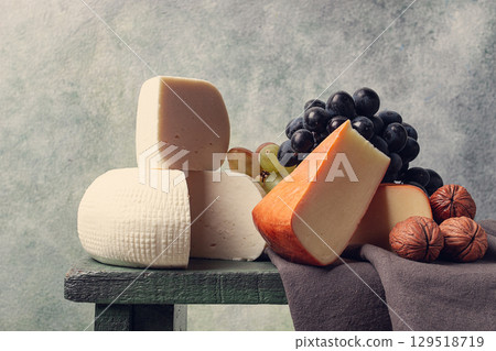 Georgian cheese, Imeretian and smoked suluguni, grapes, nuts, on a cutting board, Georgian cuisine, no people, Georgian cheese, Imeretian and smoked suluguni, grapes, nuts, on a cutting board, Georgian cuisine, no people, 129518719