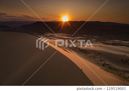 Top view of landscape: sand dune in desert at sunset Top view of landscape: sand dune in desert at sunset 129519001