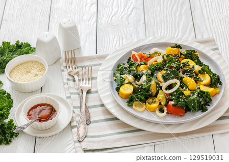 zucchini kale tomato saute sprinkled with sesame 129519031