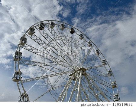 Ferris wheel on the background of blue sky in summer. High quality photo Ferris wheel on the background of blue sky in summer. High quality photo 129519652