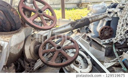 Mechanical gears and components are arranged in an industrial space, highlighting the textures of rust and metal, creating a unique atmosphere of craftsmanship and engineering Mechanical gears and components are arranged in an industrial space, highlighting the textures of rust and metal, creating a unique atmosphere of craftsmanship and engineering 129519675