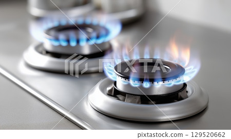 Flames rising from a gas stove during dinner preparation at home Flames rising from a gas stove during dinner preparation at home 129520662