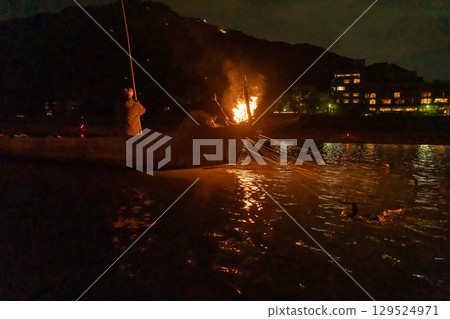 Gifu City, Gifu Prefecture: Cormorant fishermen and cormorants at Nagara River Cormorant Fishing, held around a bonfire on the Nagara River. 129524971