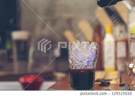 Latte art coffee cup with milk on wooden table. Espresso shot make latte art hot coffee cup. Cappuccino with milk in italian coffee shop cafe. Brown hot caffeine beverage in cafeteria with copy space 129525038