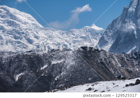 Beautiful view of snowcapped mountains seen from Tsergo Ri viewpoint in Langtang valley, Nepal. It is located in a mountain range of the Jugal Himal in the Central Himalayas. Beautiful view of snowcapped mountains seen from Tsergo Ri viewpoint in Langtang valley, Nepal. It is located in a mountain range of the Jugal Himal in the Central Himalayas. 129525317
