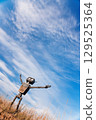 Robot on a background of blue sky 129525364