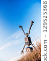Robot on a background of blue sky 129525368