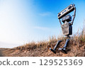 Robot on a background of blue sky 129525369