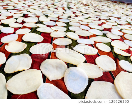 Homemade Sun Drying Potato Slices for Chips 129526390