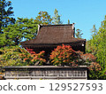 Bell tower wrapped in autumn leaves 129527593