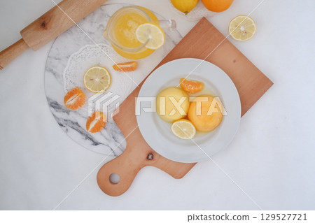 Homemade Citrus Pudding with Lemonade in Background Homemade Citrus Pudding with Lemonade in Background 129527721