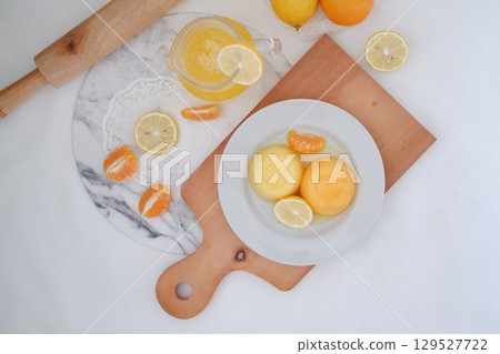 Homemade Citrus Pudding with Lemonade in Background 129527722