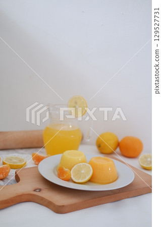 Homemade Citrus Pudding with Lemonade in Background 129527731