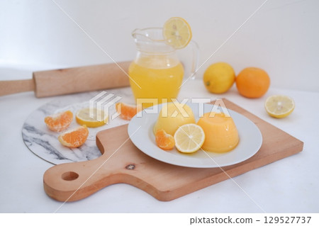 Homemade Citrus Pudding with Lemonade in Background 129527737