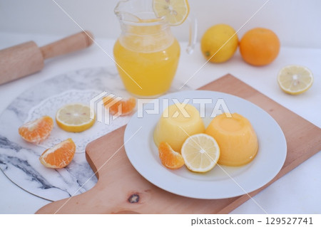 Homemade Citrus Pudding with Lemonade in Background Homemade Citrus Pudding with Lemonade in Background 129527741