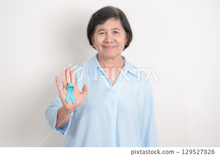 Elderly with blue Ribbon for concept of blue November, November Prostate Cancer Awareness month, World Diabetes day , Men Health month, International men, Father day. Healthcare and world cancer day 129527826