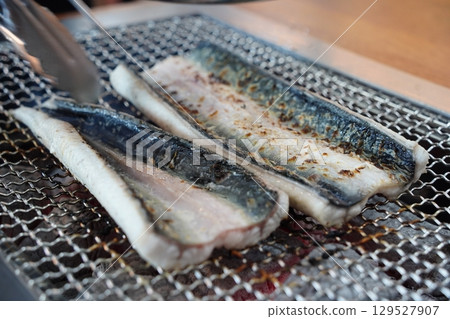 Eel Fillets Grilling on Metal Grid Eel Fillets Grilling on Metal Grid 129527907