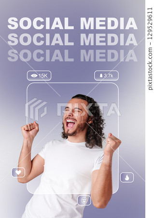 Happy man celebrating success with raised fists in a studio against a plain background 129529611