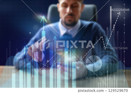 Business professional analyzes financial data in a modern office setting during the day using digital charts for better decision making Business professional analyzes financial data in a modern office setting during the day using digital charts for better decision making 129529670