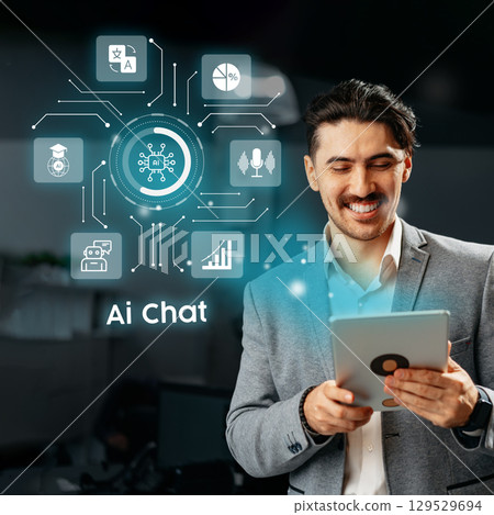 Professional man engages with AI chat technology in a modern office environment Professional man engages with AI chat technology in a modern office environment 129529694