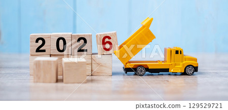 2026 Happy New year with miniature truck or construction vehicle. New Start, Vision, Resolution, goal, industrial, Warehouse concept 129529721