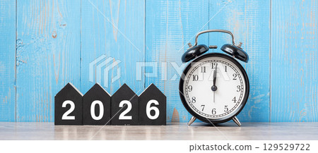 2026 Happy New Year with retro alarm clock and wooden number. New Start, Resolution, Goals, Plan, Action and Mission Concept 2026 Happy New Year with retro alarm clock and wooden number. New Start, Resolution, Goals, Plan, Action and Mission Concept 129529722