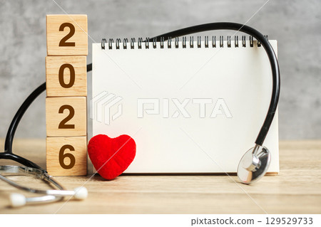 2026 Happy New Year for healthcare, Insurance, Wellness and medical concept. Stethoscope and blank notebook for copy space your text 2026 Happy New Year for healthcare, Insurance, Wellness and medical concept. Stethoscope and blank notebook for copy space your text 129529733