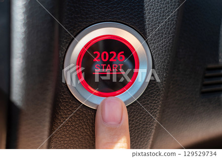 Finger press a car ignition button with 2026 START text inside automobile. New Year New You, forecast, resolution, motivation, change, goal, vision, innovation and planning concept Finger press a car ignition button with 2026 START text inside automobile. New Year New You, forecast, resolution, motivation, change, goal, vision, innovation and planning concept 129529734
