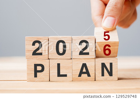 hand flipping block 2025 to 2026 PLAN text on table. Resolution, strategy, goal, motivation, reboot, business and New Year holiday concepts hand flipping block 2025 to 2026 PLAN text on table. Resolution, strategy, goal, motivation, reboot, business and New Year holiday concepts 129529748