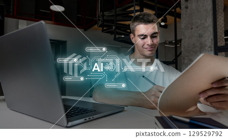 Young person engaged in creative work with AI assistance in modern office space during the day 129529792