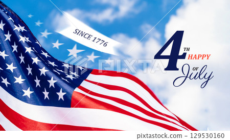 Celebrating Independence Day with vibrant American flag waving against a blue sky 129530160